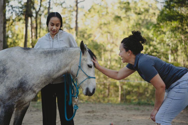 Brisbane equine facilitated learning student with practitioner Camille Fenton