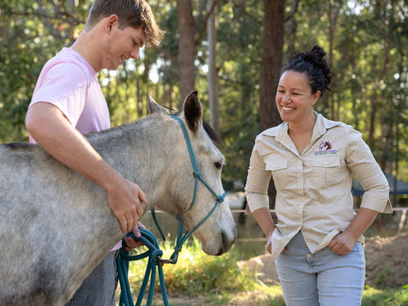 Horse therapy session with Camille and client at Caspian Herd